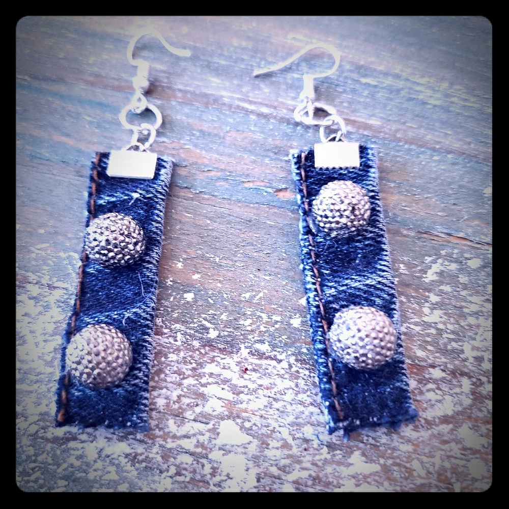 Denim earrings with sparkles on them.